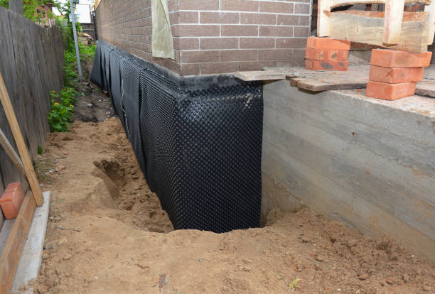 SJ Waterproofing Pros technician performing targeted Waterproofing assessment in Batavia, IL